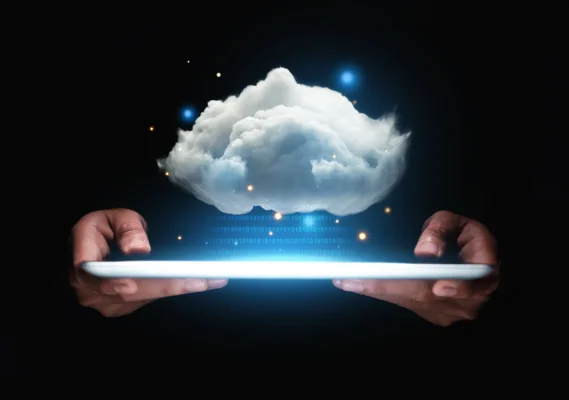 Cloud services for SMBs depicted by an image of a Cloud hanging over a tablet.